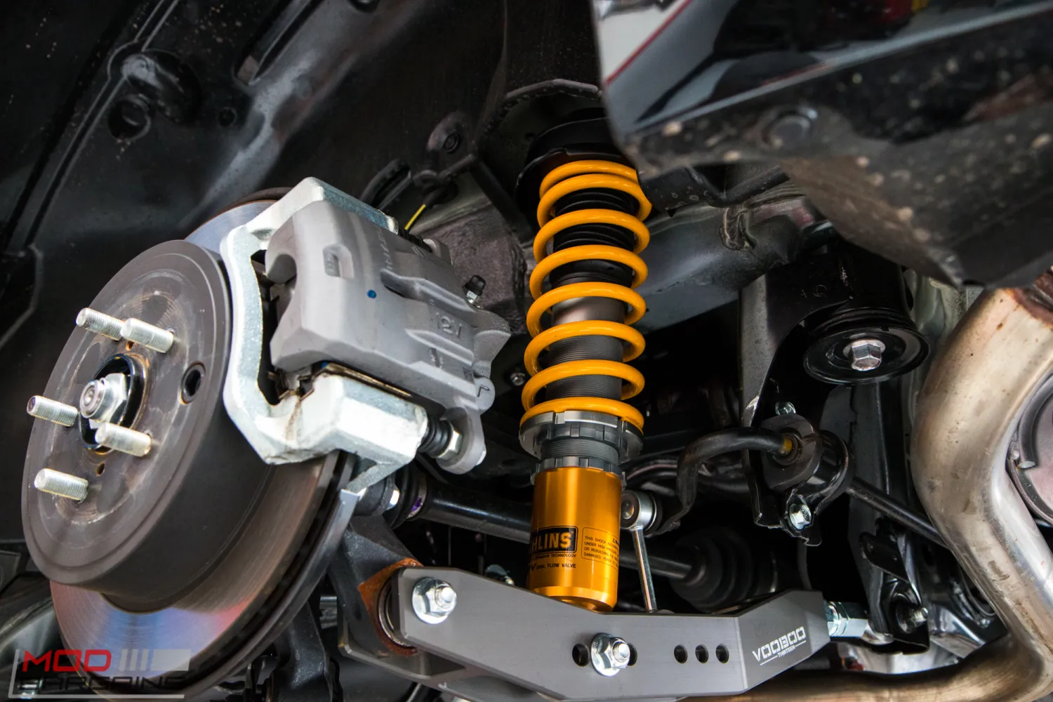 Orange automotive suspension that has been installed